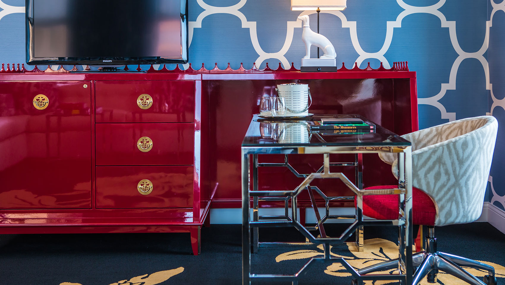 Closeup of desk, chair, dresser and TV in guestrrom at Kimpton Hotel Monaco Philadelphia