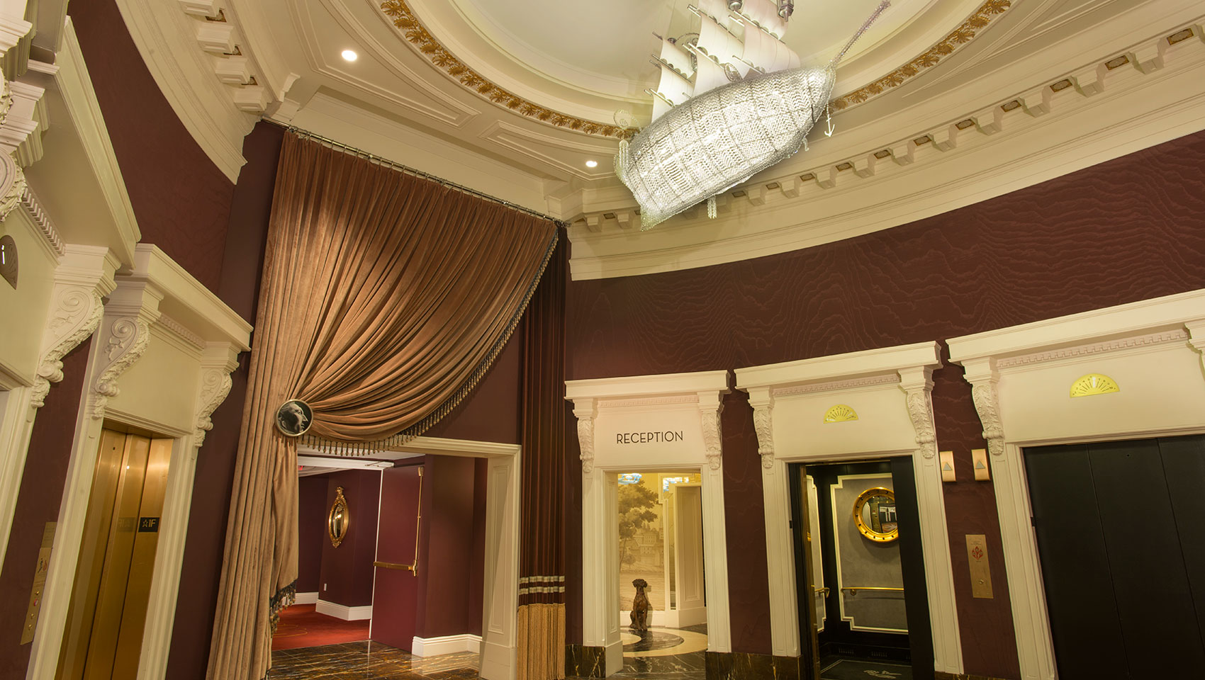 View of reception and elevators at Kimpton Hotel Monaco Philadelphia