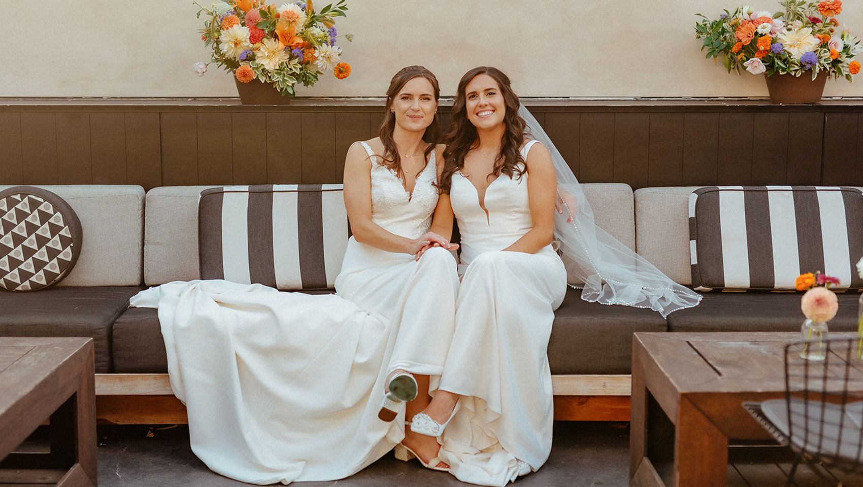 Brides sit on rooftop
