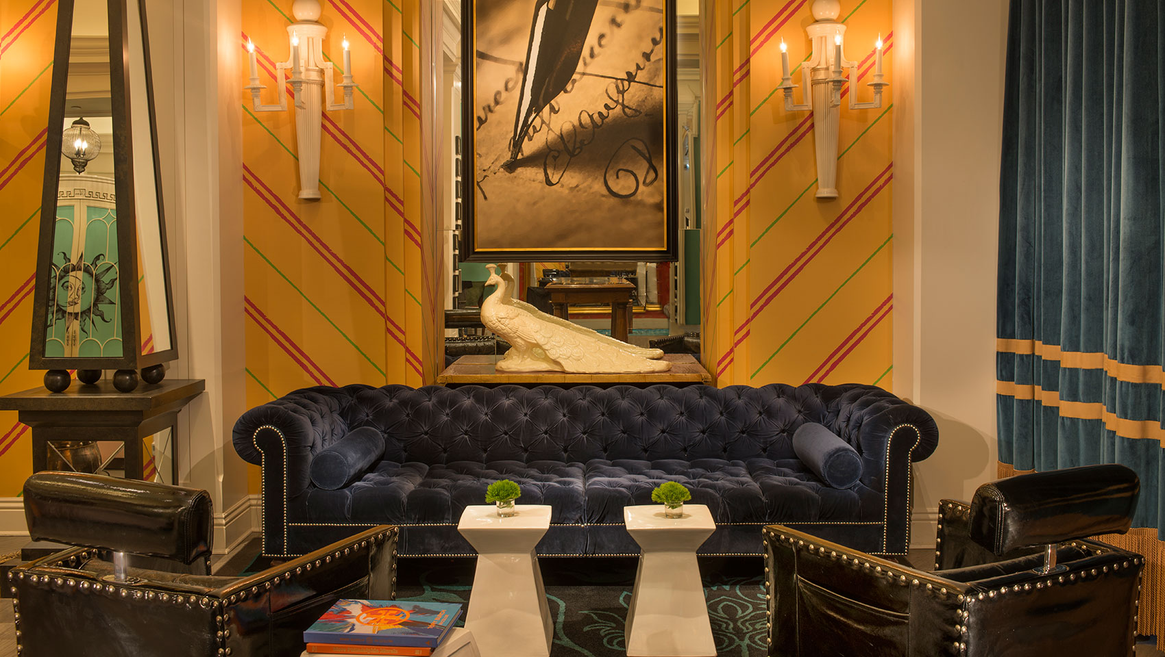 white peacock statue above couch in lobby living room at Kimpton Hotel Monaco Philadelphia